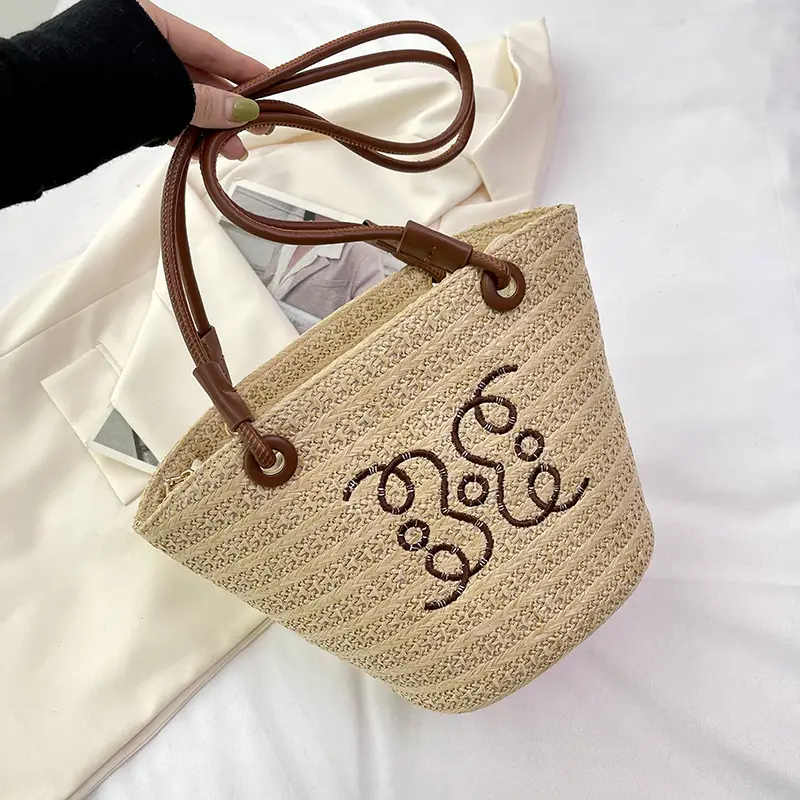 Women Woven Straw Crossbody Bag with Monogram Design - Image 2