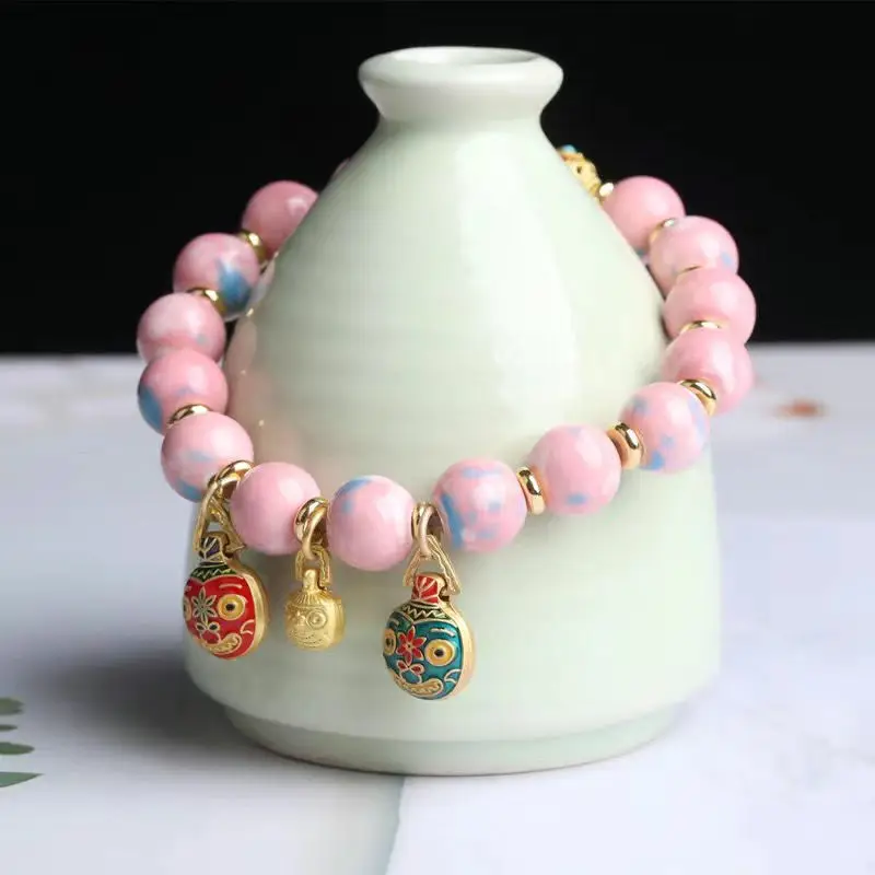 Golden Buddha Bead Bracelet for Women with Gold Swallow Design