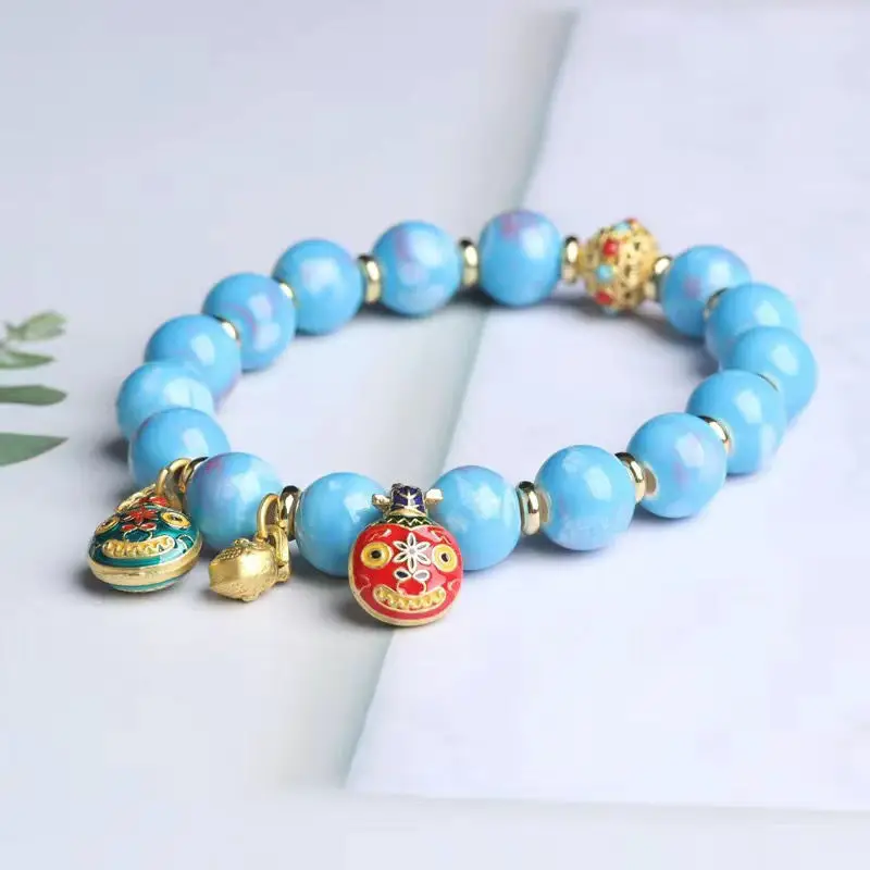 Golden Buddha Bead Bracelet for Women with Gold Swallow Design