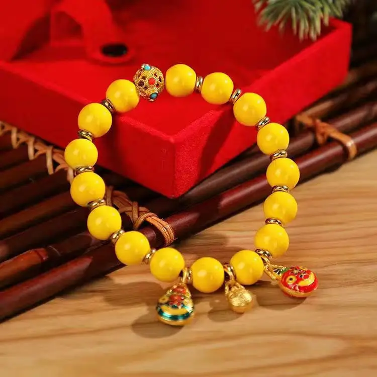 Golden Buddha Bead Bracelet for Women with Gold Swallow Design