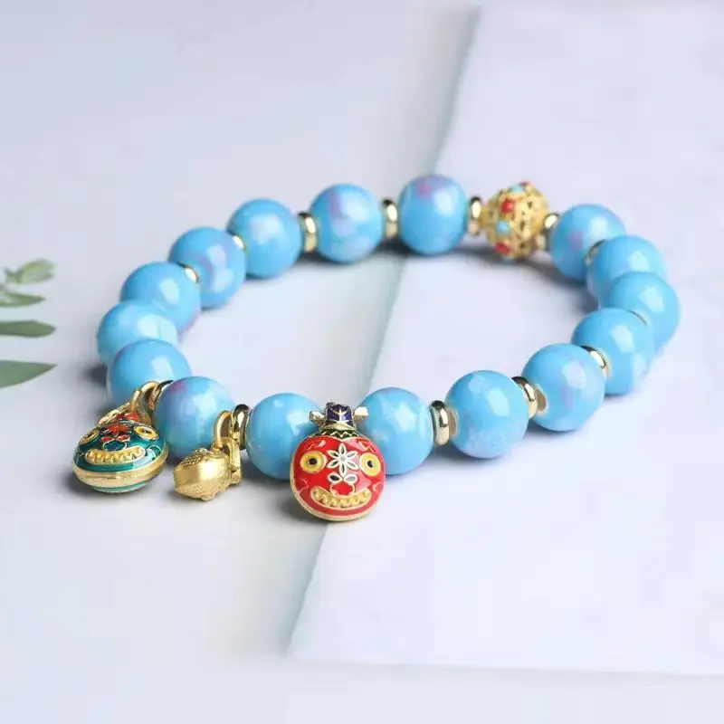 Golden Buddha Bead Bracelet for Women with Gold Swallow Design