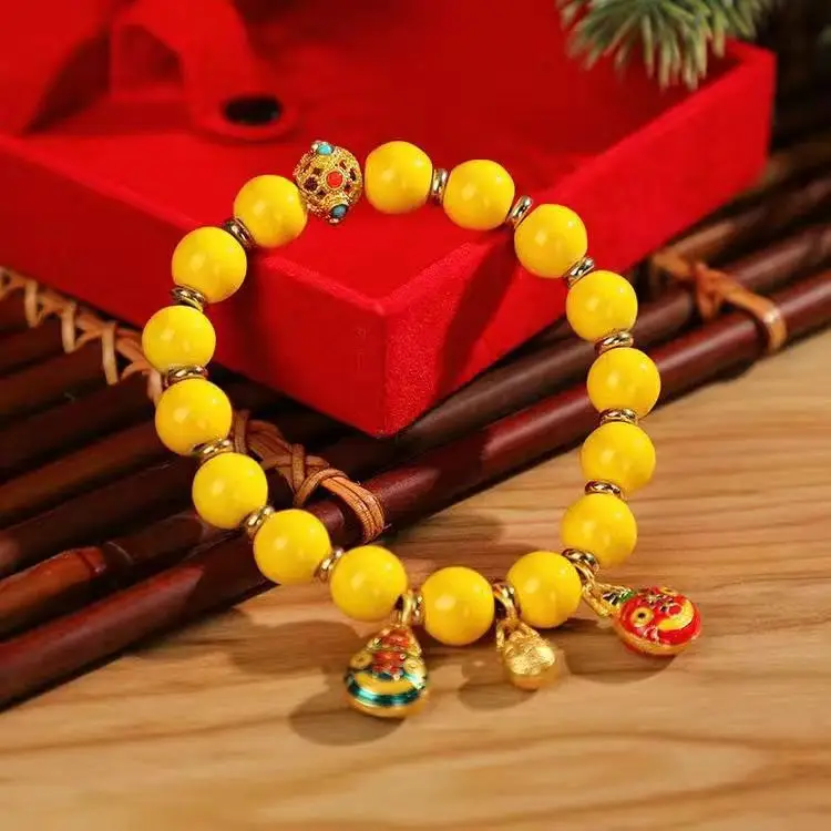 Golden Buddha Bead Bracelet for Women with Gold Swallow Design