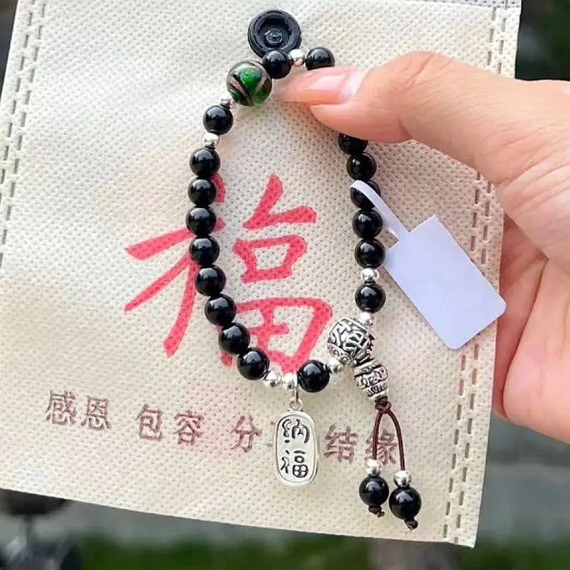 New Xiangji Black Glass Bracelet with Green Glass Pendant — feature 4