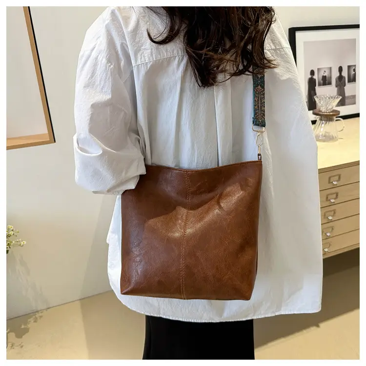 Brown Leather Ethnic Shoulder Bag with Crossbody Strap — feature 21