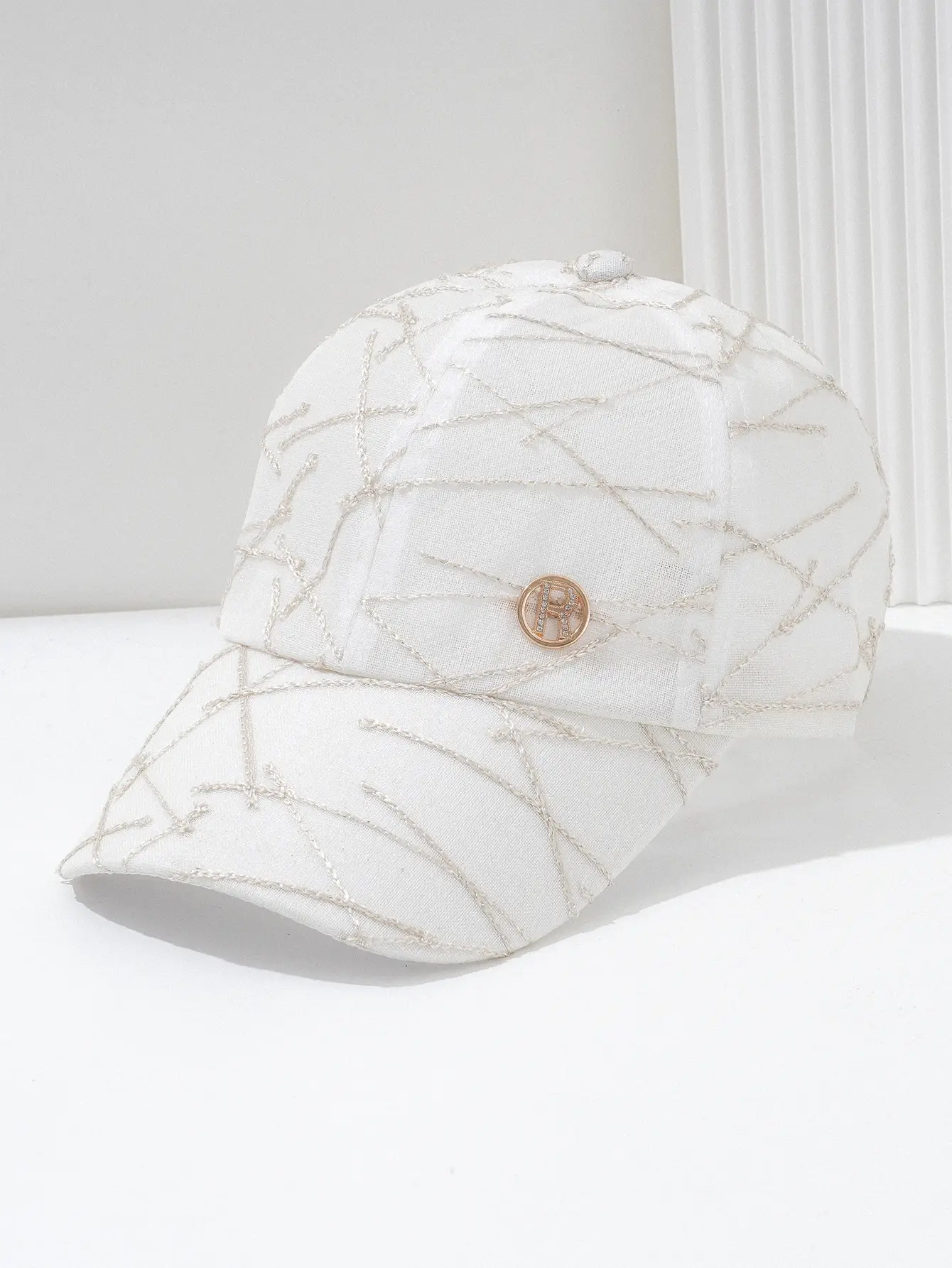 Black Quilted Travel Cap with Metal Button — feature 2