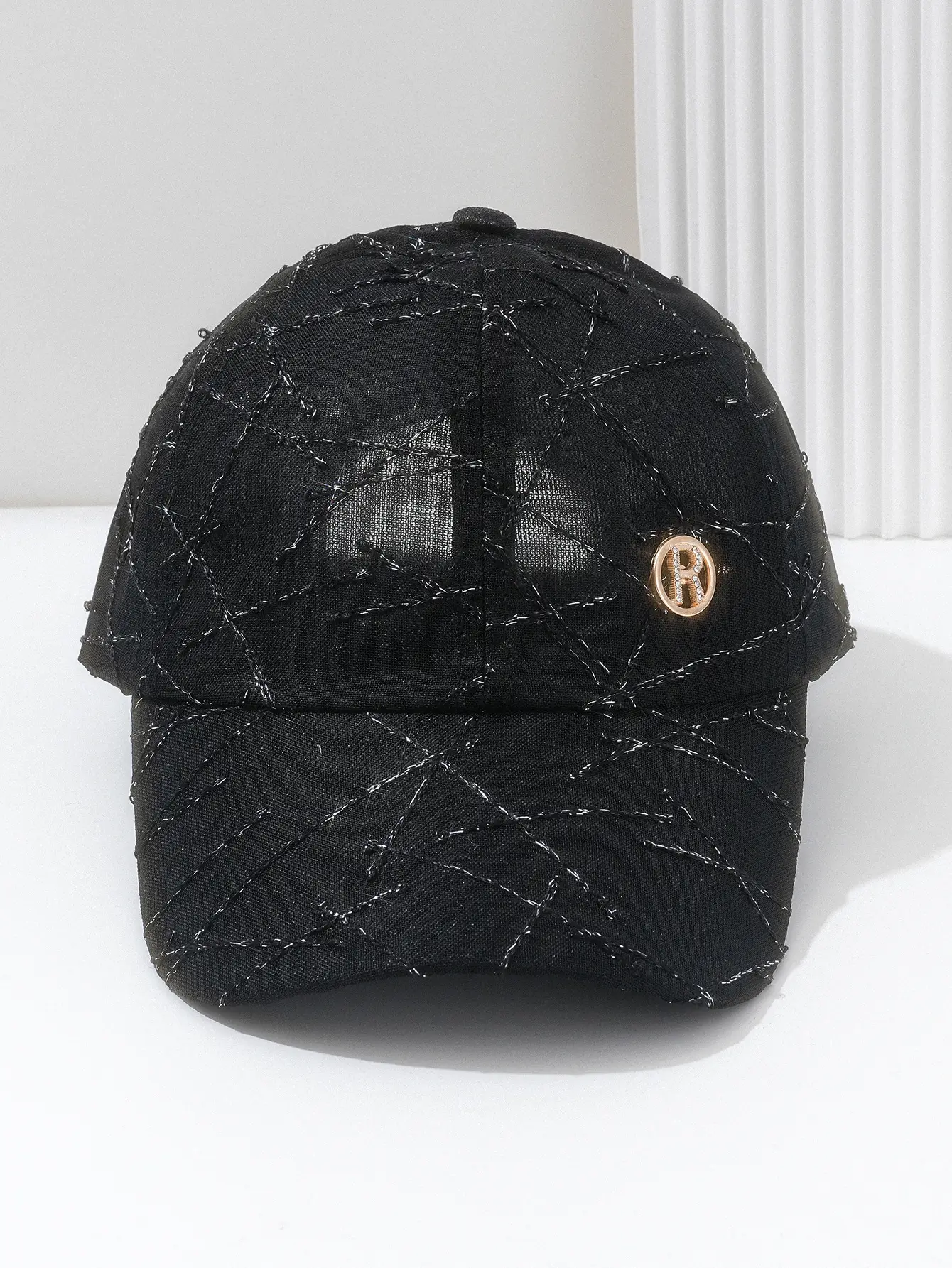 Black Quilted Travel Cap with Metal Button — feature 6