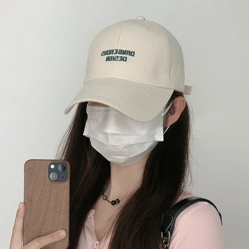 Beige Women's Curved Eaves Baseball Cap with "DANGEROUS DESIGN"