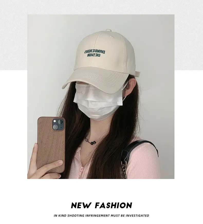 Beige Women's Curved Eaves Baseball Cap with "DANGEROUS DESIGN" — feature 3