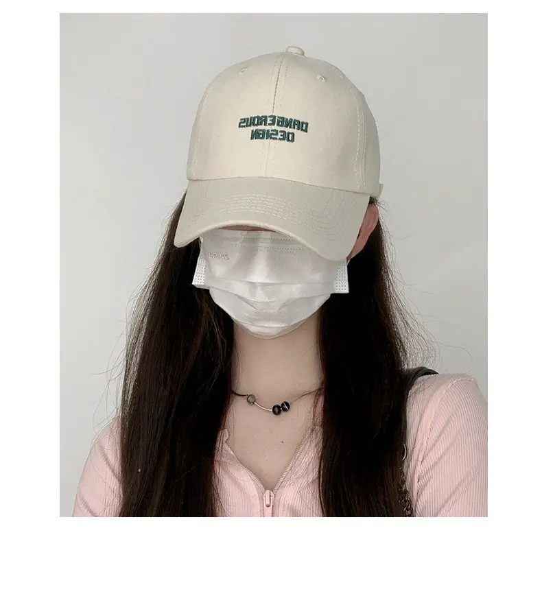 Beige Women's Curved Eaves Baseball Cap with "DANGEROUS DESIGN" — feature 9
