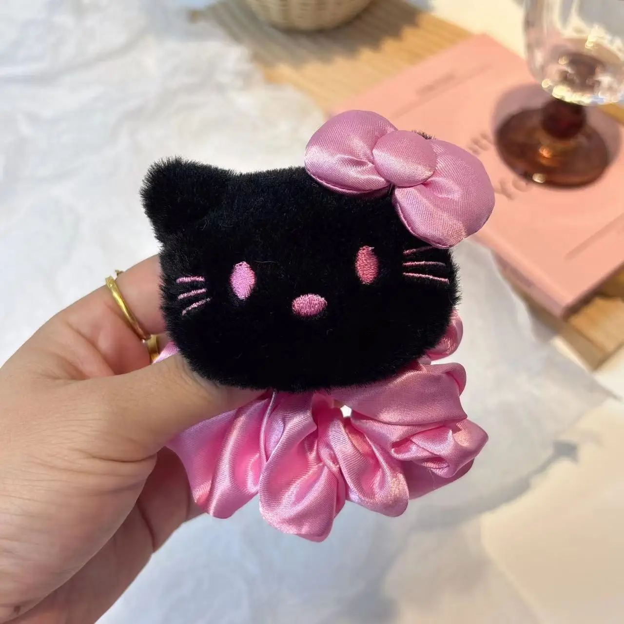 Pink bow-black KT hair ring