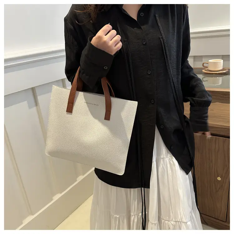 Black Leather Shoulder Bag with Brown Handles — feature 11