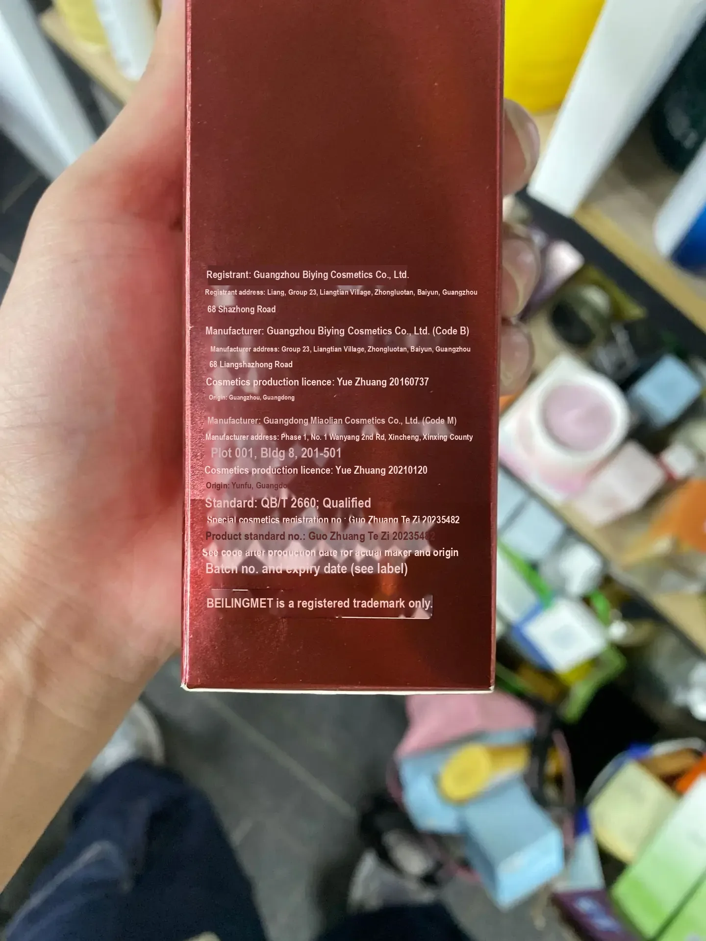 Red product box panel with manufacturer and registration text.
