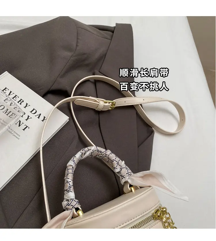 White Woven Silk Handbag with Gold Tassel Handles — feature 12