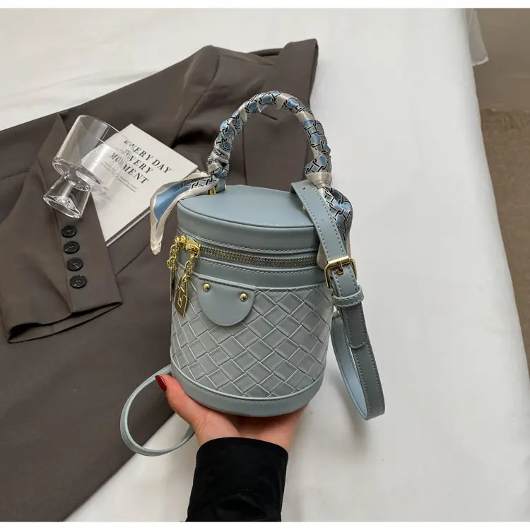 White Woven Silk Handbag with Gold Tassel Handles — feature 23