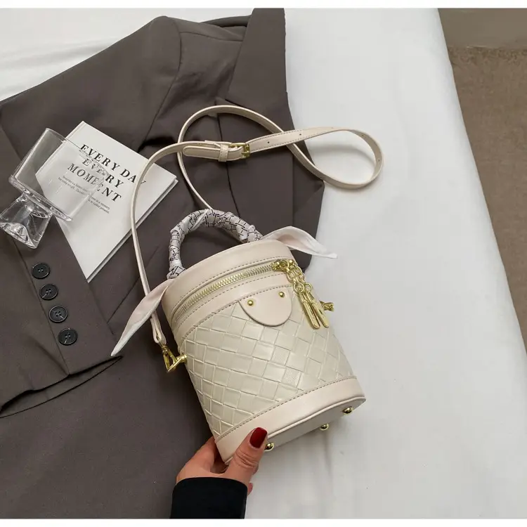 White Woven Silk Handbag with Gold Tassel Handles — feature 34