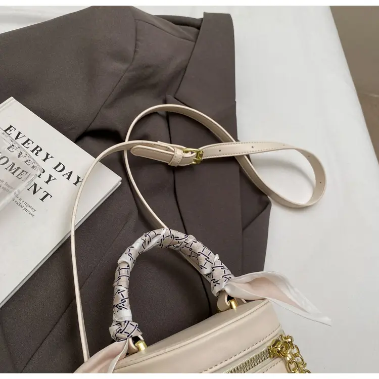 White Woven Silk Handbag with Gold Tassel Handles — feature 35