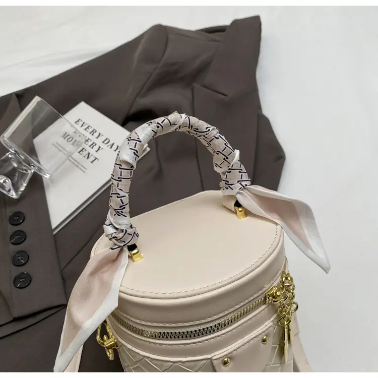 White Woven Silk Handbag with Gold Tassel Handles — feature 39