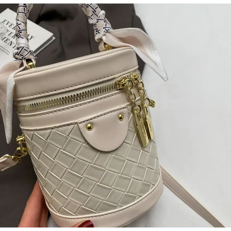 White Woven Silk Handbag with Gold Tassel Handles — feature 42