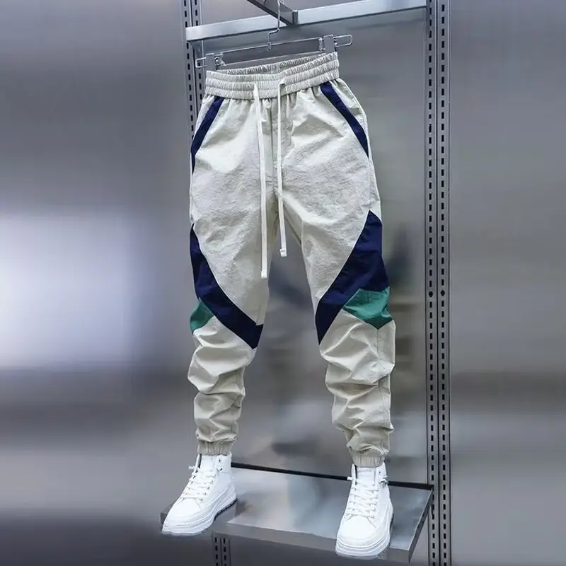 Men Beige Stripe Track Pants with White Sneakers — feature 3