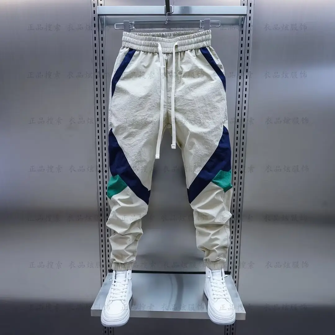 Men Beige Stripe Track Pants with White Sneakers — feature 9