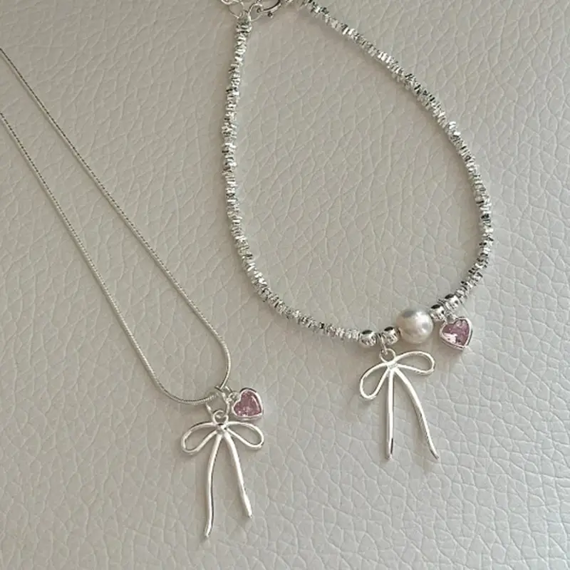 Broken Silver Bracelet with Love Bow & Pearl Accents - Image 4