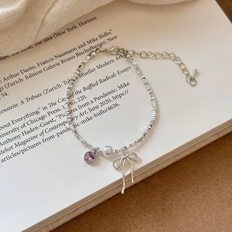 Broken Silver Bracelet with Love Bow & Pearl Accents - Image 6