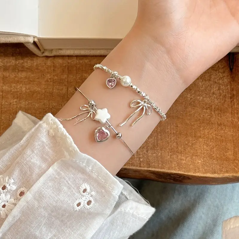 Broken Silver Bracelet with Love Bow & Pearl Accents — feature 2