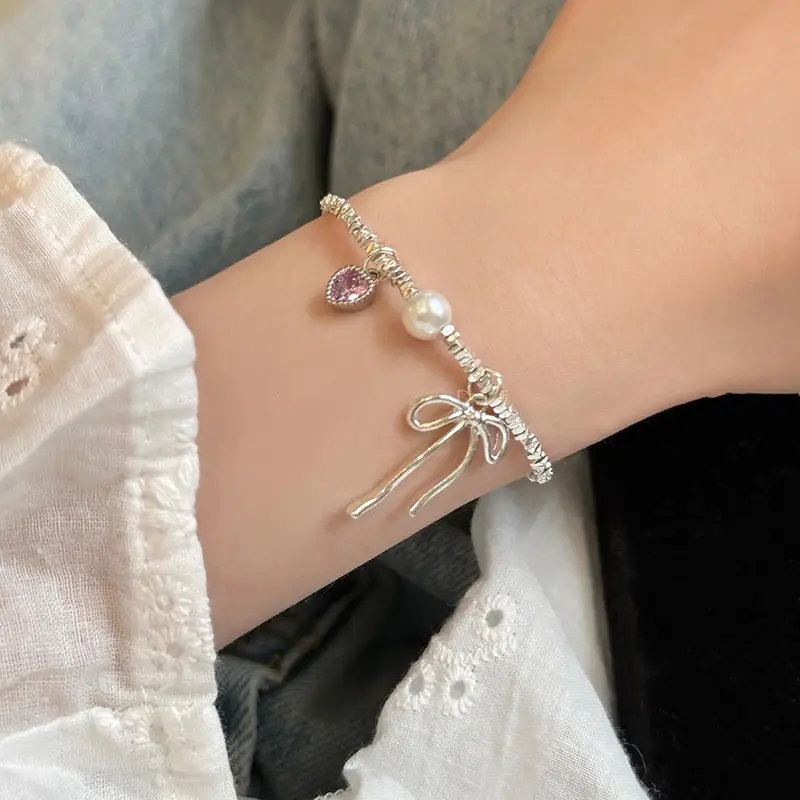 Broken Silver Bracelet with Love Bow & Pearl Accents — feature 3