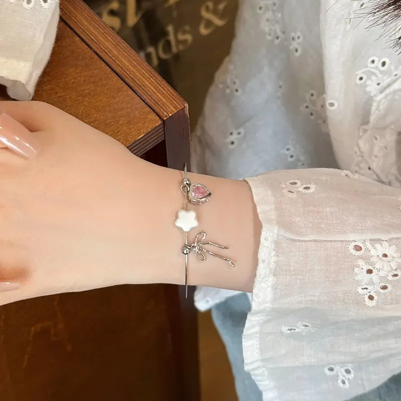 Broken Silver Bracelet with Love Bow & Pearl Accents — feature 4