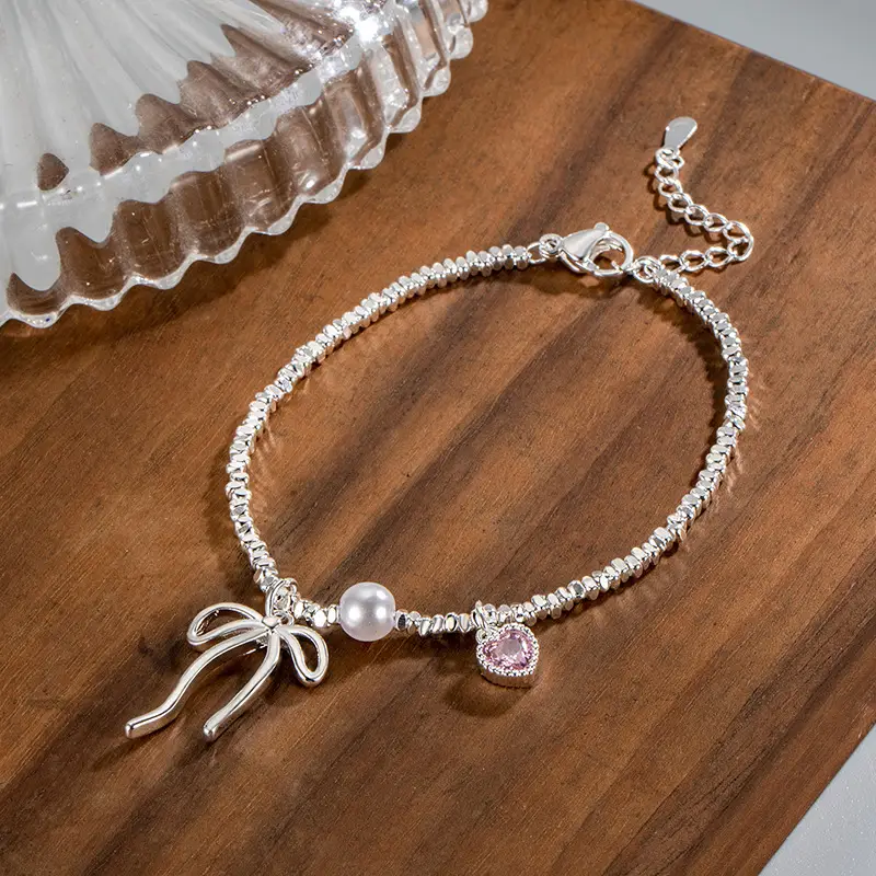 Broken Silver Bracelet with Love Bow & Pearl Accents — feature 6