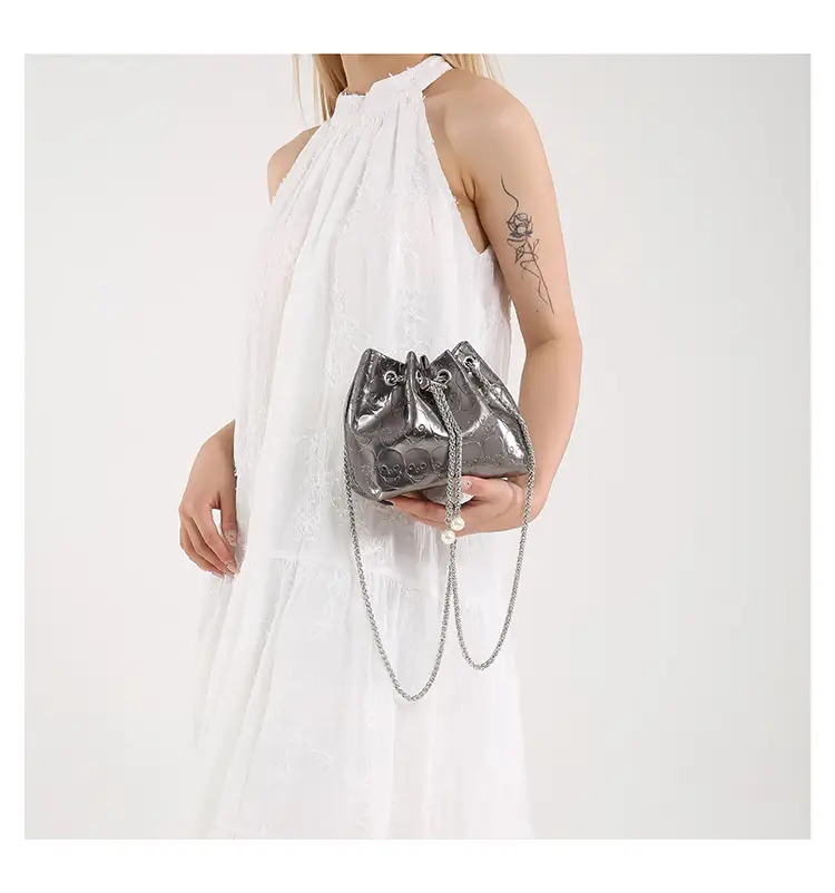 Golden Drawstring Bucket Bag with Chain Crossbody Strap — feature 34