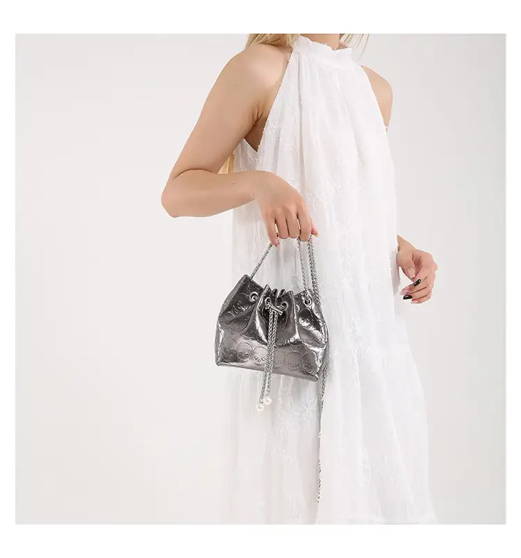 Golden Drawstring Bucket Bag with Chain Crossbody Strap — feature 35
