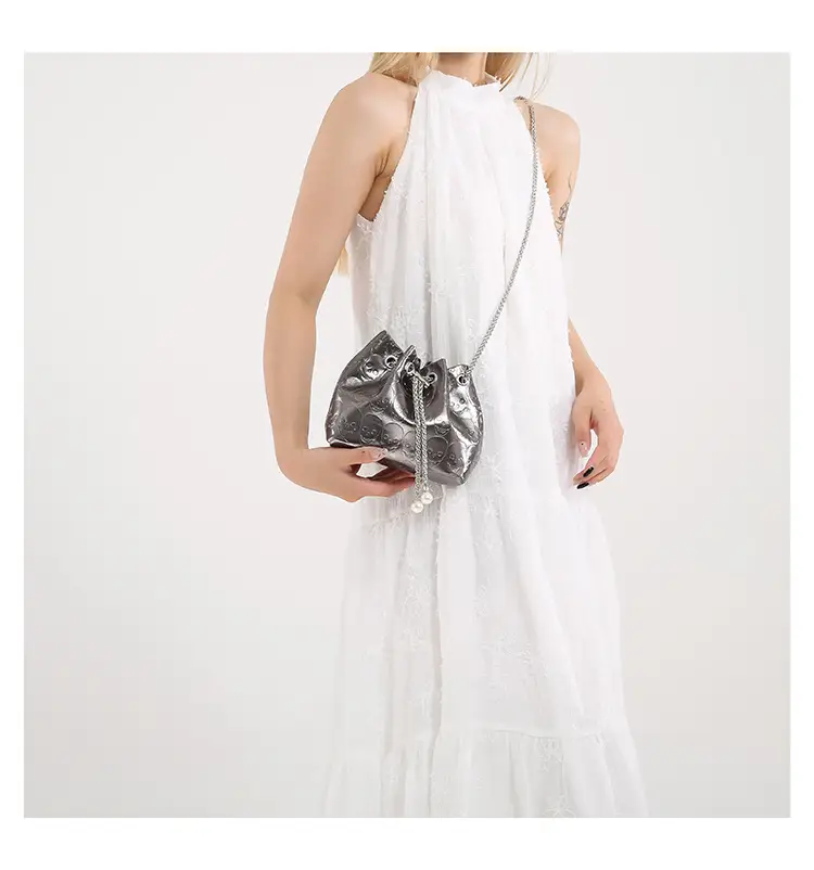 Golden Drawstring Bucket Bag with Chain Crossbody Strap — feature 36