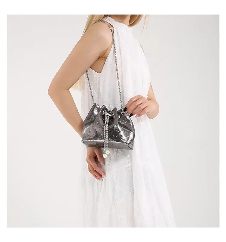Golden Drawstring Bucket Bag with Chain Crossbody Strap — feature 37