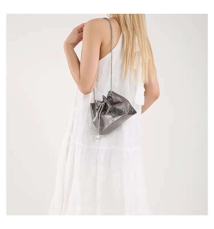 Golden Drawstring Bucket Bag with Chain Crossbody Strap — feature 38