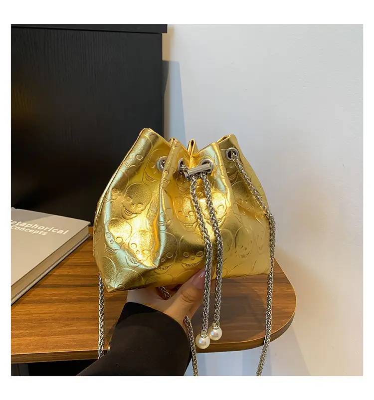 Golden Drawstring Bucket Bag with Chain Crossbody Strap — feature 39