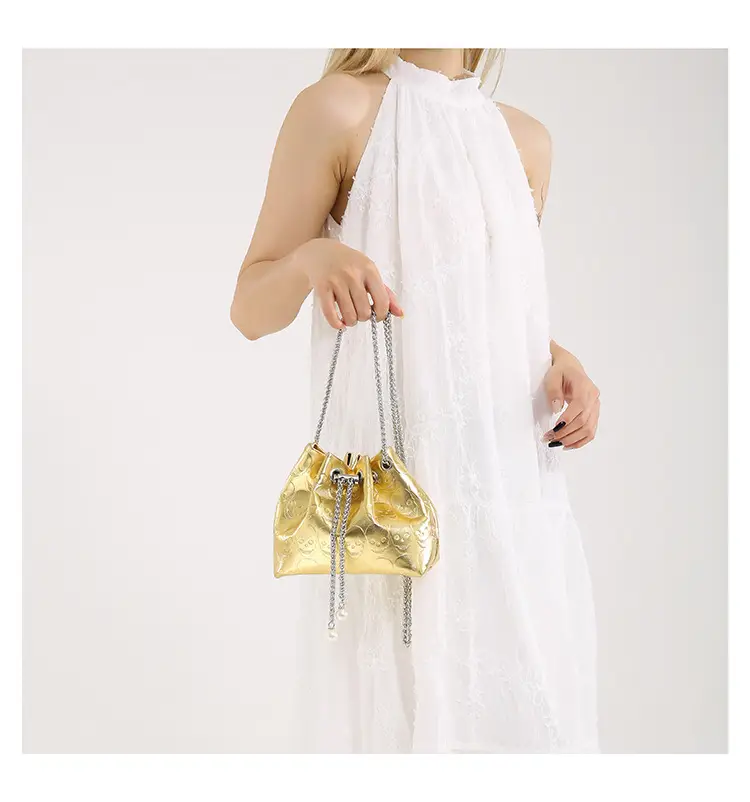 Golden Drawstring Bucket Bag with Chain Crossbody Strap — feature 43