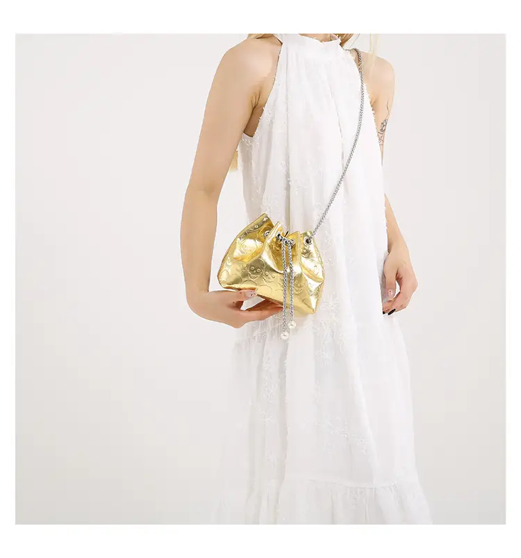 Golden Drawstring Bucket Bag with Chain Crossbody Strap — feature 44