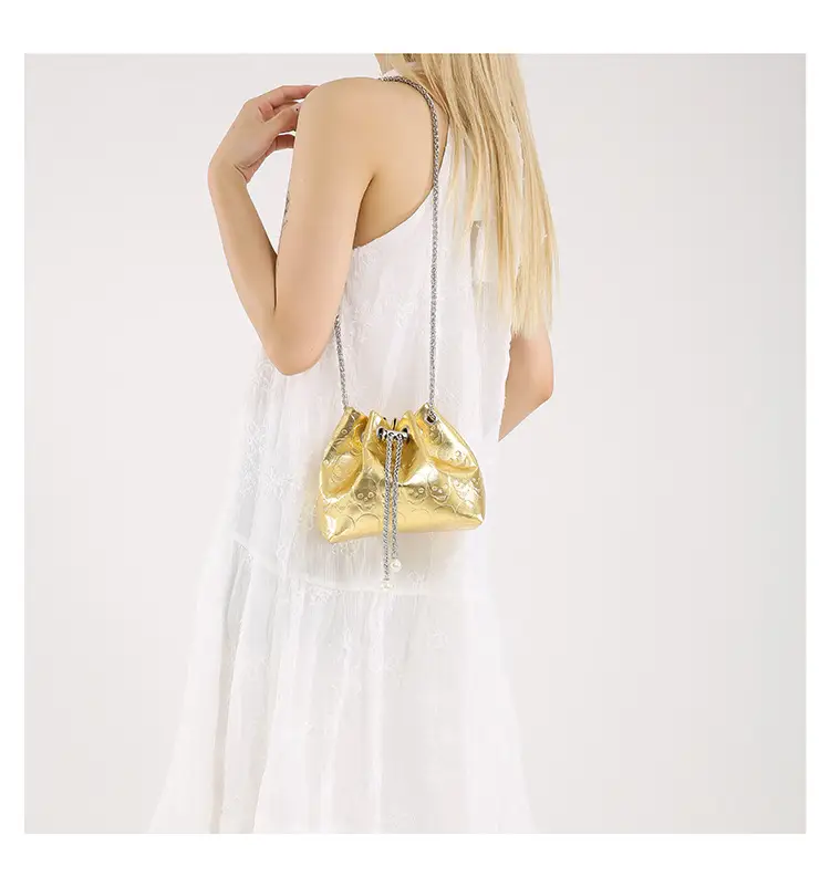 Golden Drawstring Bucket Bag with Chain Crossbody Strap — feature 45