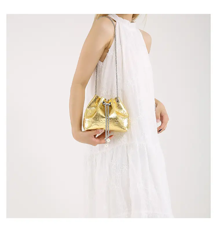 Golden Drawstring Bucket Bag with Chain Crossbody Strap — feature 46