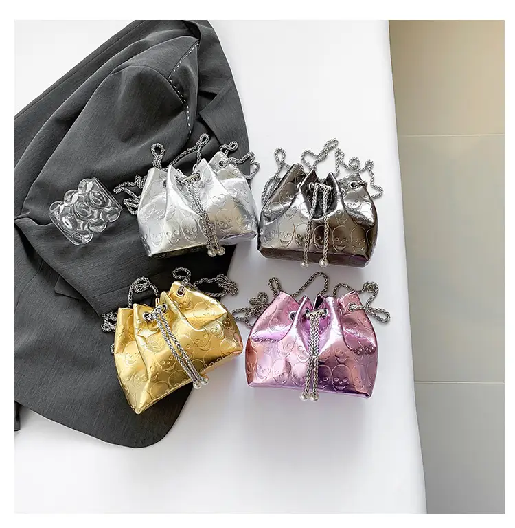 Golden Drawstring Bucket Bag with Chain Crossbody Strap — feature 9