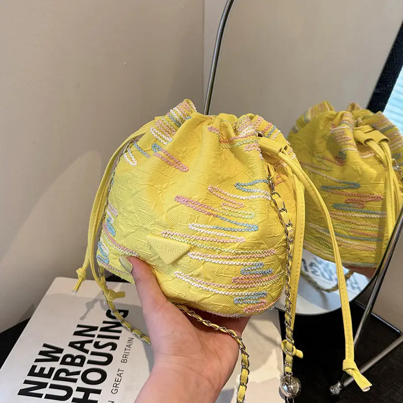 Yellow Drawstring Bucket Bag with Embroidery and Chain Strap