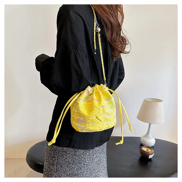 Yellow Drawstring Bucket Bag with Embroidery and Chain Strap — feature 21