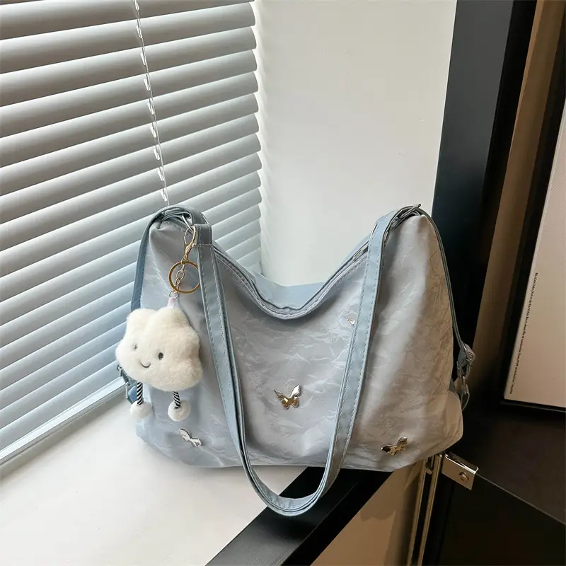 Women's Creamy Soft Shoulder Bag with Pom Pom Design - Image 4