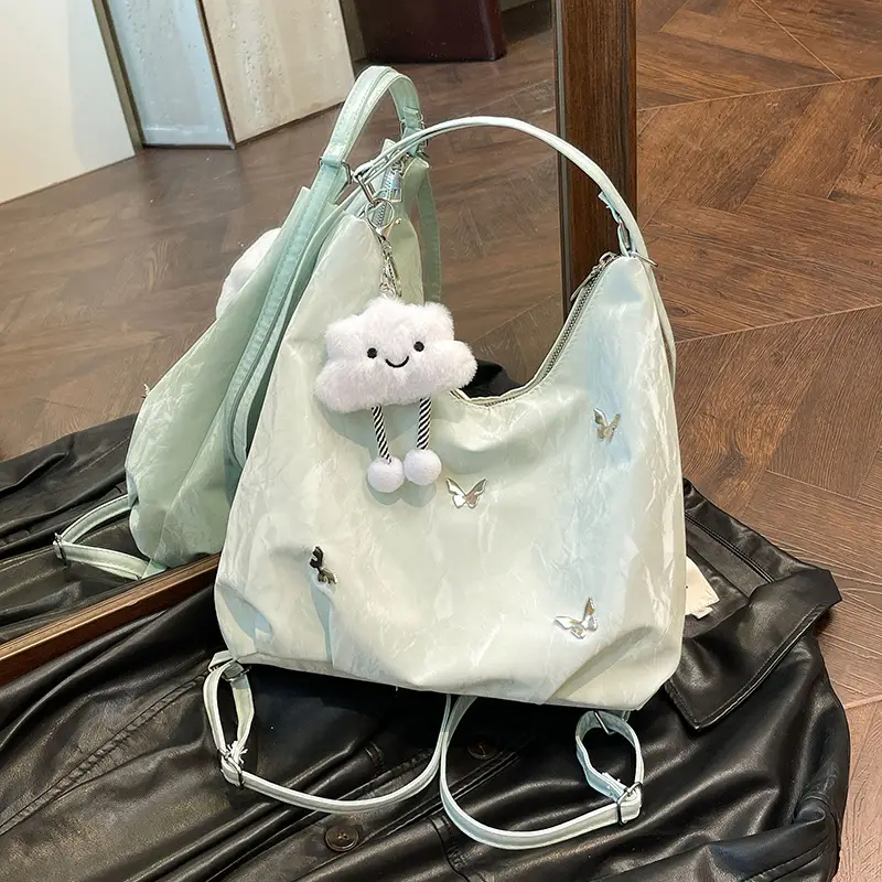 Silver Butterfly Shoulder Bag with Pom Pom Charm - Image 14