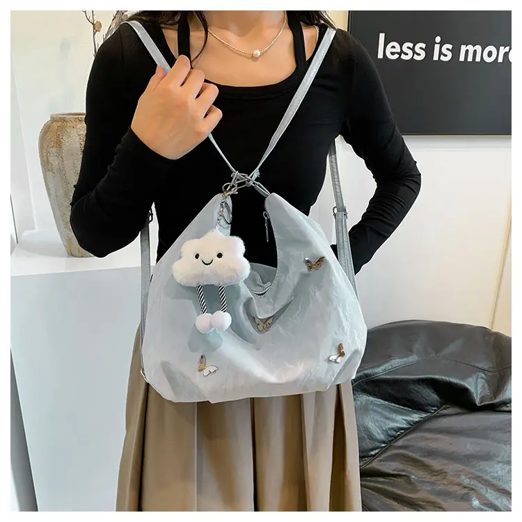 Silver Butterfly Shoulder Bag with Pom Pom Charm — feature 12