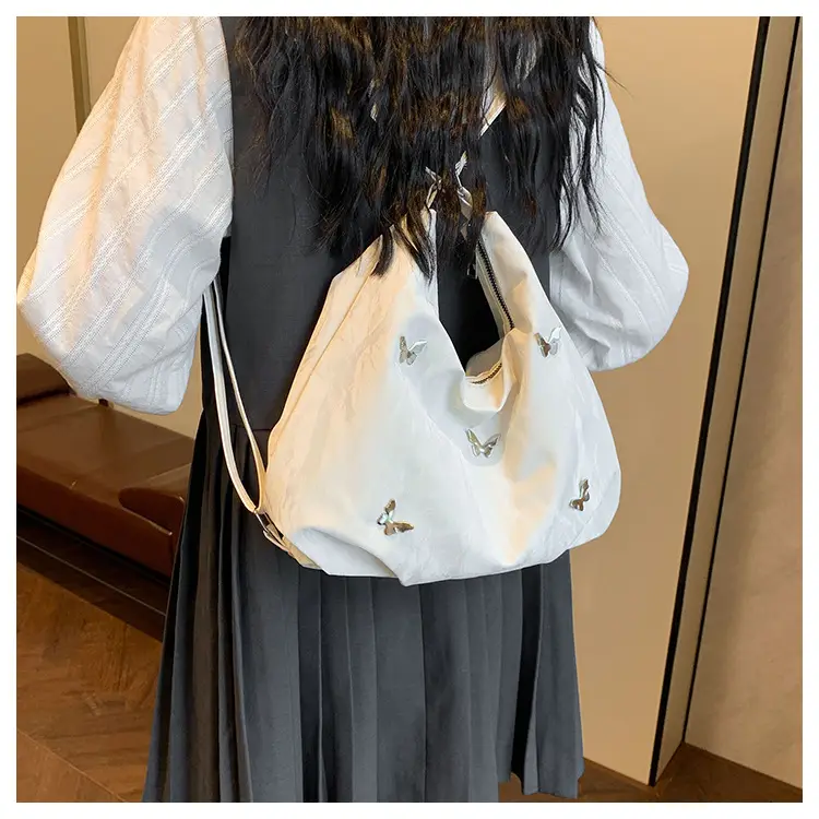 Silver Butterfly Shoulder Bag with Pom Pom Charm — feature 14