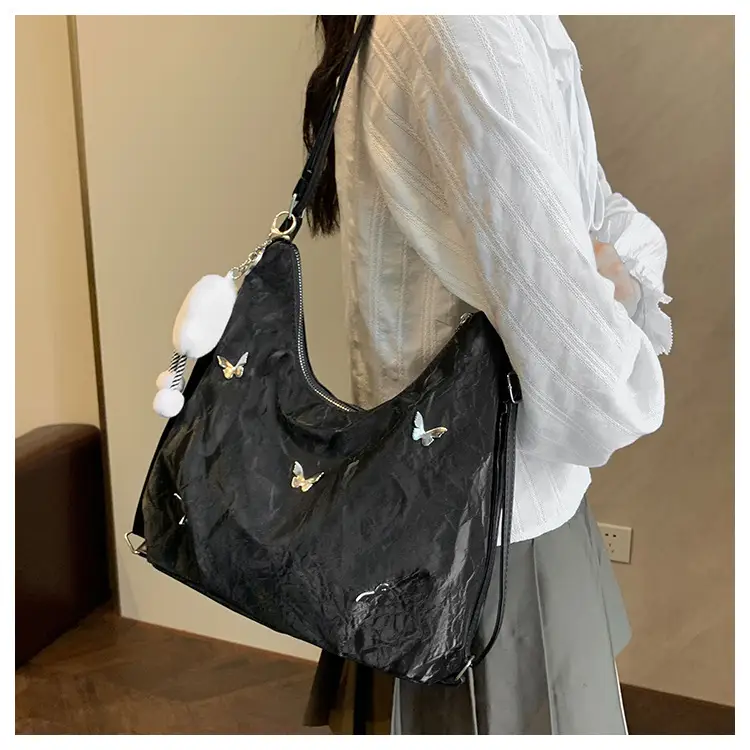 Silver Butterfly Shoulder Bag with Pom Pom Charm — feature 16