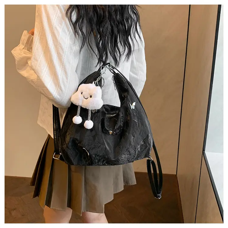 Silver Butterfly Shoulder Bag with Pom Pom Charm — feature 17