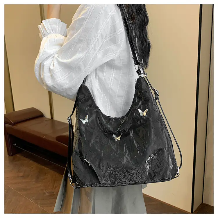 Silver Butterfly Shoulder Bag with Pom Pom Charm — feature 18
